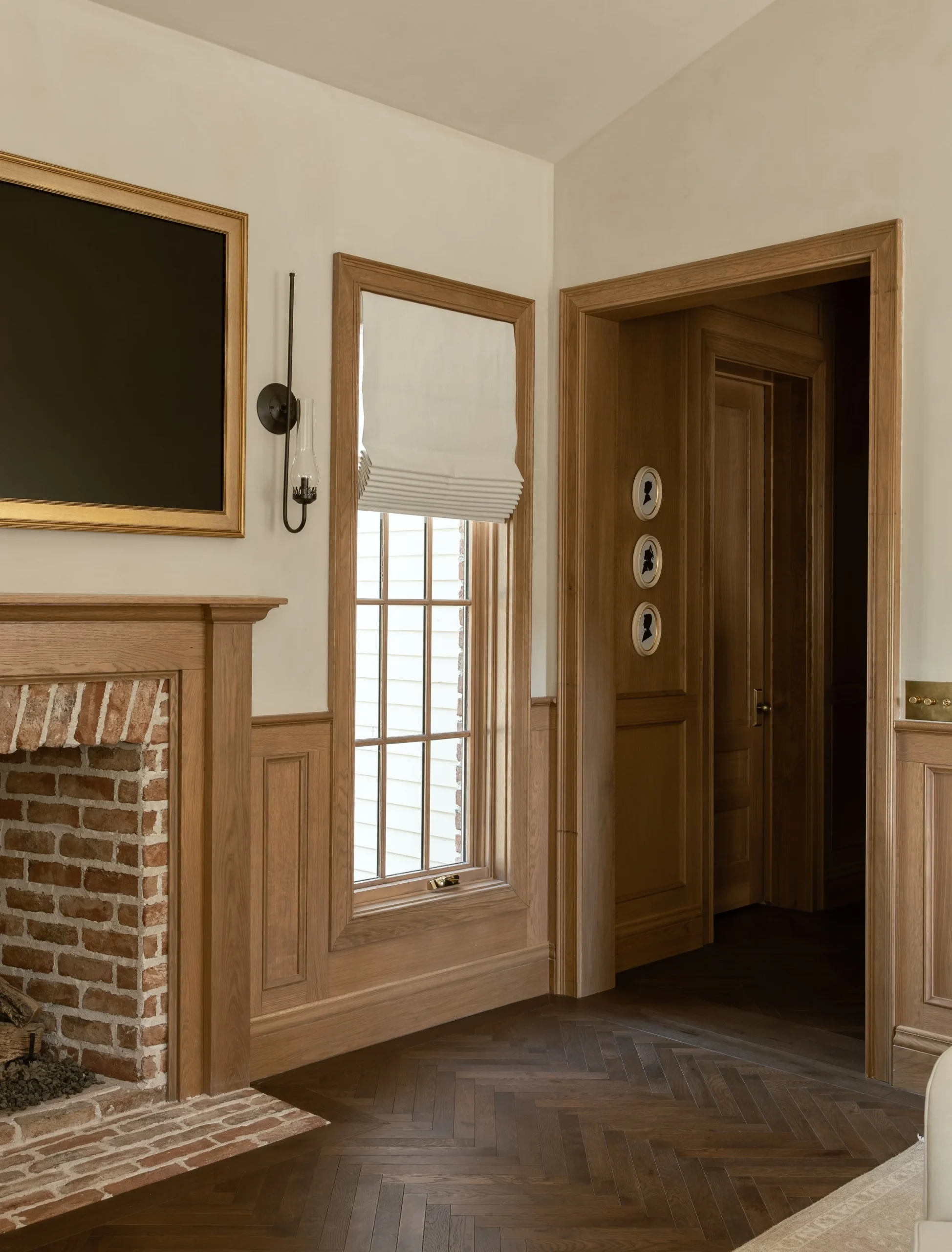 How to mix dark wood floors with light oak wainscoting and millwork. W Design Collective
