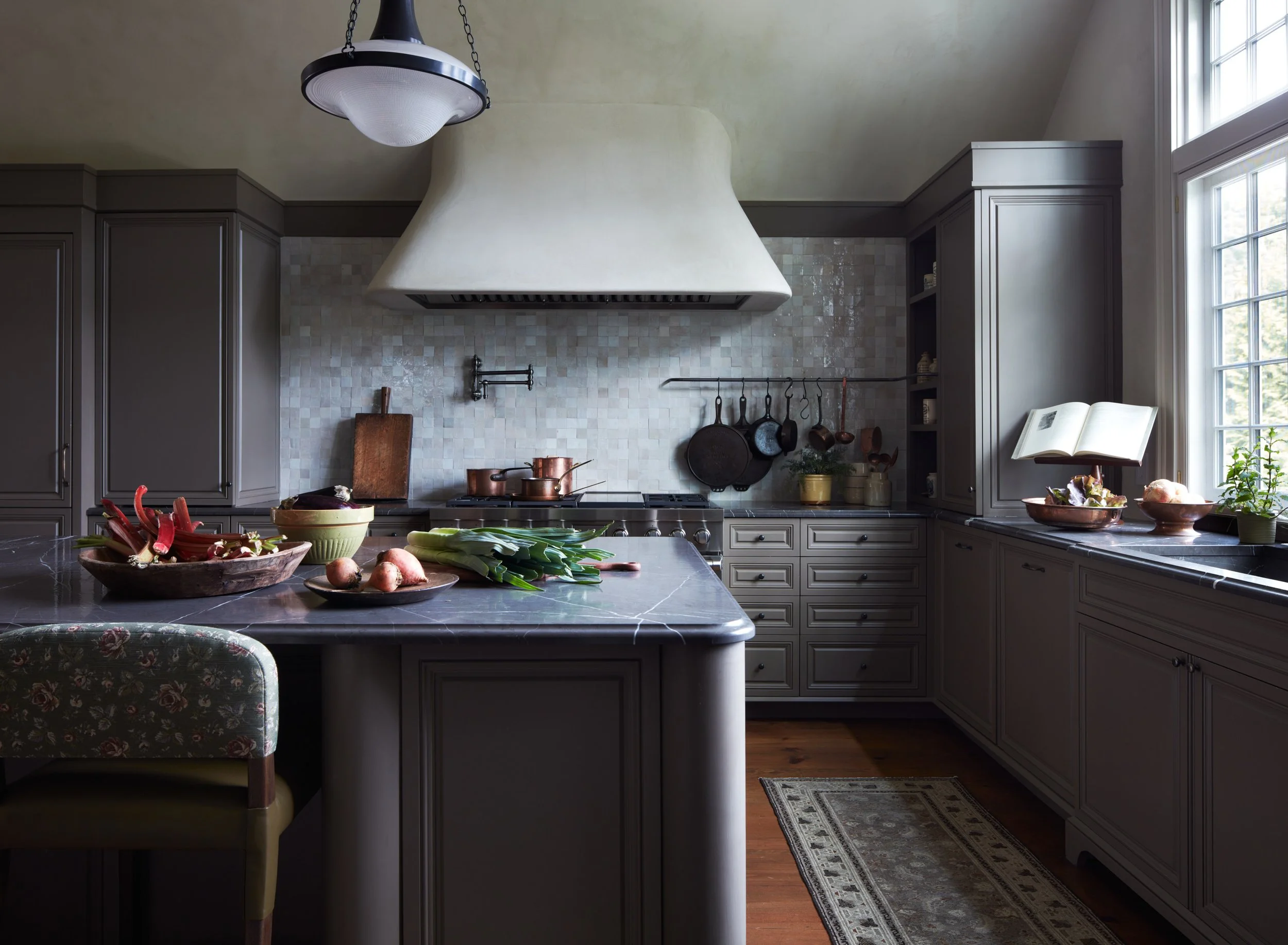 Moody kitchen with efficient kitchen layout by Moore House Design