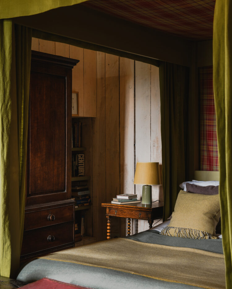 Rustic castle bedroom with wood armoire.