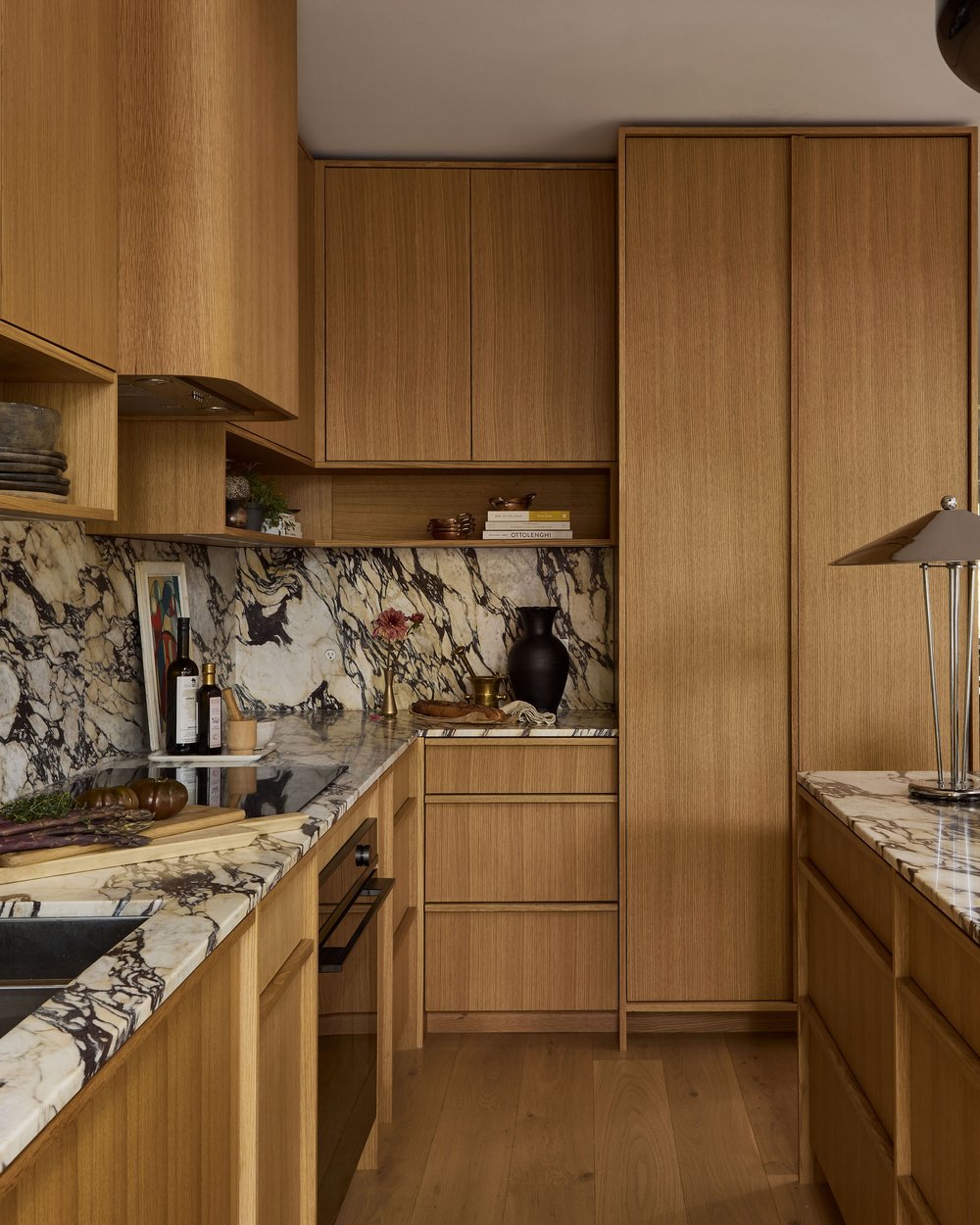 Lauren Miller x Sarah Birnie - Beech Ave. Wood kitchen cabinets and marble countertop and backsplash. Design planning tips
