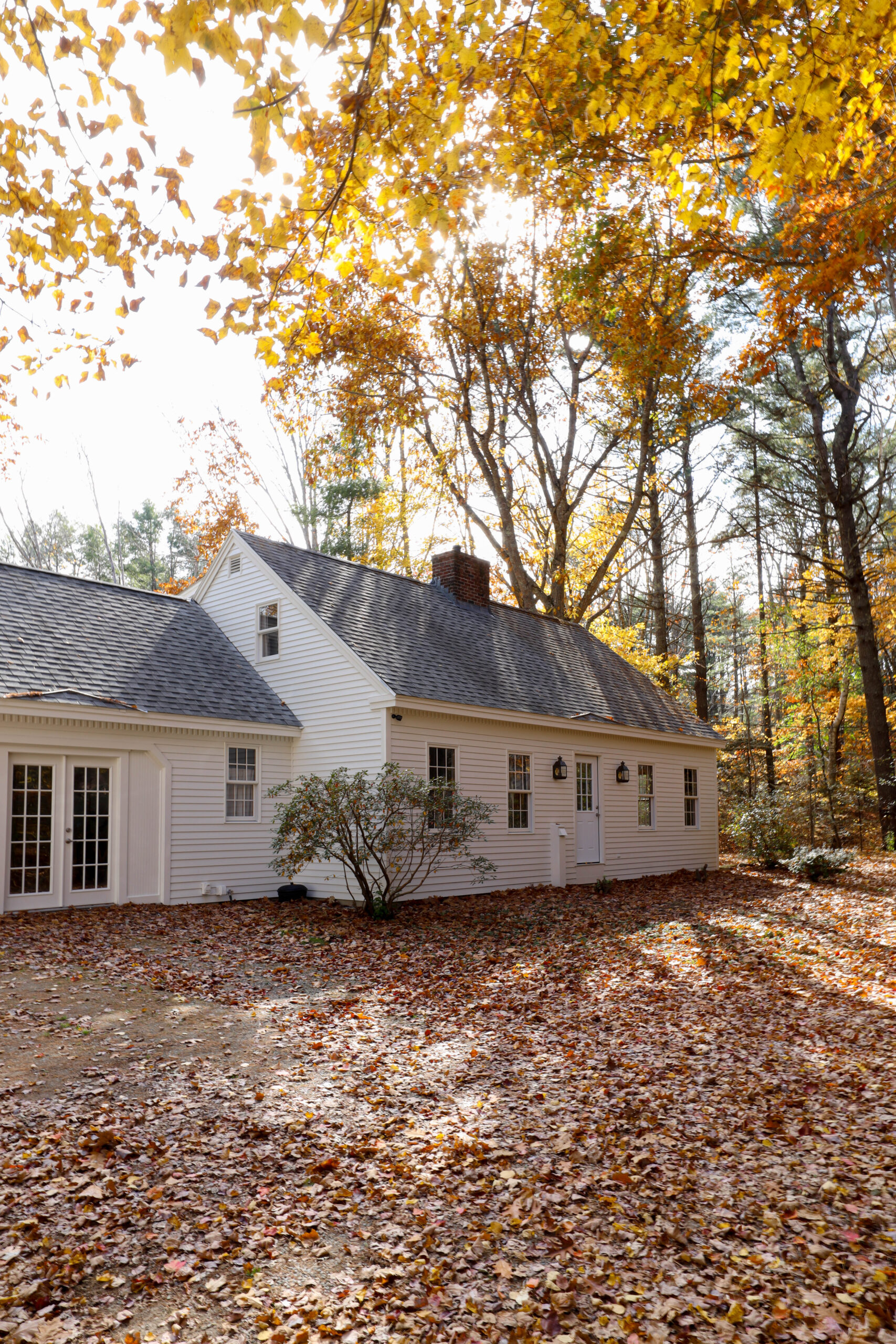 Cape cod exterior makeover. Cape cod paint color. Warm cream exterior paint color. Fall in Maine. Nadine Stay