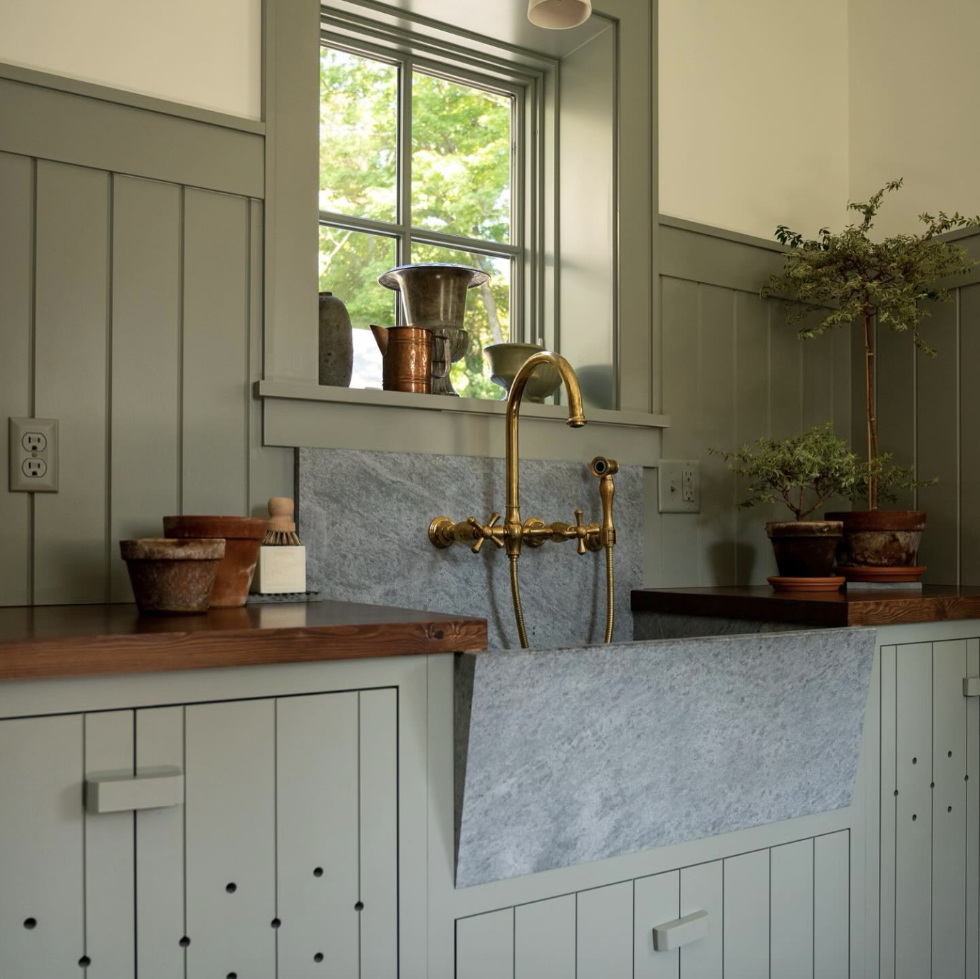 The best green paint colors, according to interior designers. Pigeon by Farrow & Ball. Mudroom cabinetry design by Elizabeth Williams Buck & Amelia Cabinet Company