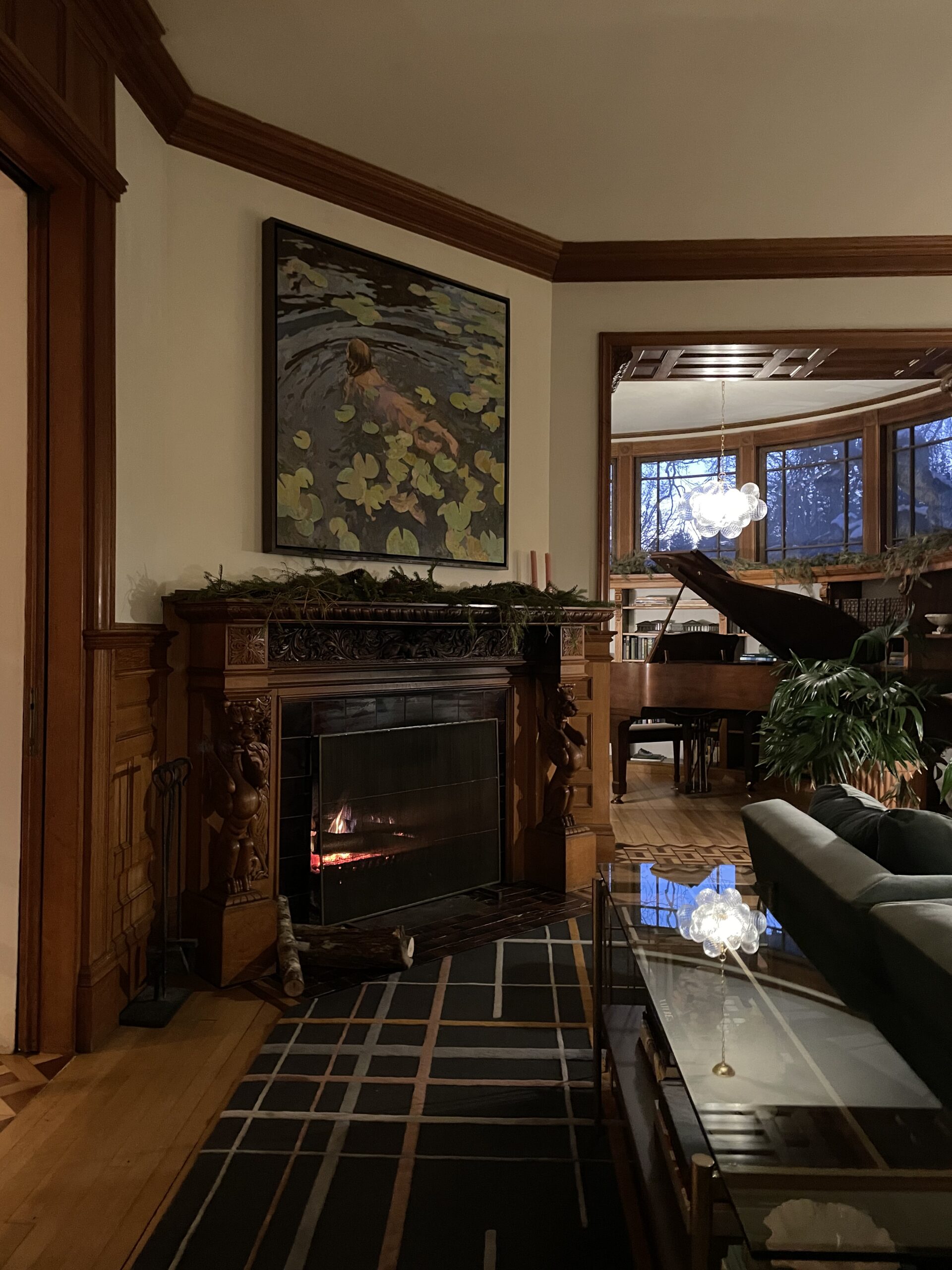 Corner fireplace with wood mantel in a historic Victorian home - Nadine Stay